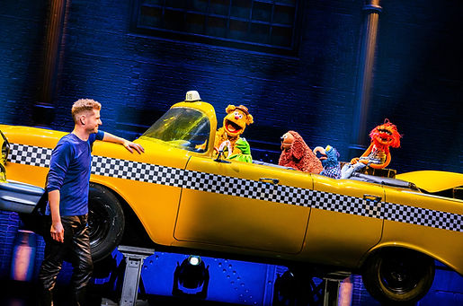 Rob Lake makes a taxi appear onstage in a grand illusion on Broadway with The Muppets