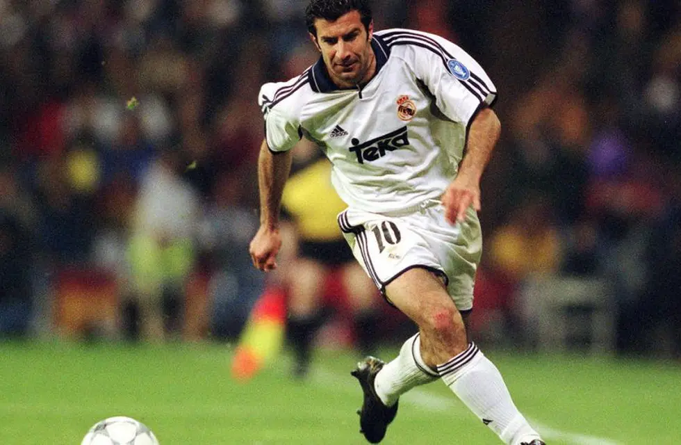 Luis Figo playing for Real Madrid dribbling the ball