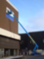 Image of a large external sign being fitted after manufacture by EP Cowens sign maker of Birkenhead