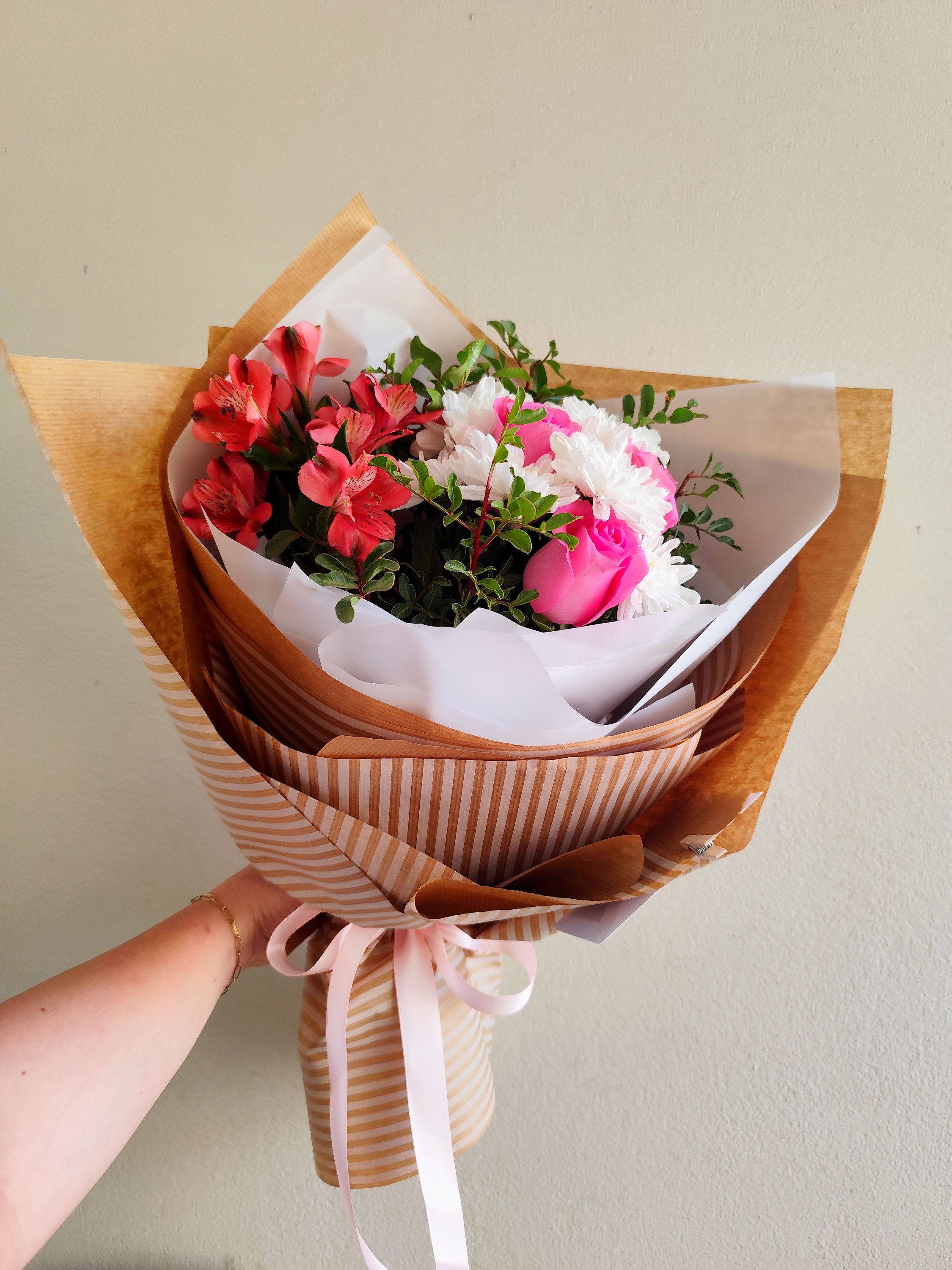Classic Rose & Alstroemeria Bouquet with roses, alstroemerias, chrysanthemums and pistachio greenery.