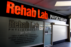 a sign for rehab lab physiotherapy says it is open