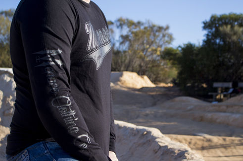 a person wearing a long sleeve shirt with the word wings on it