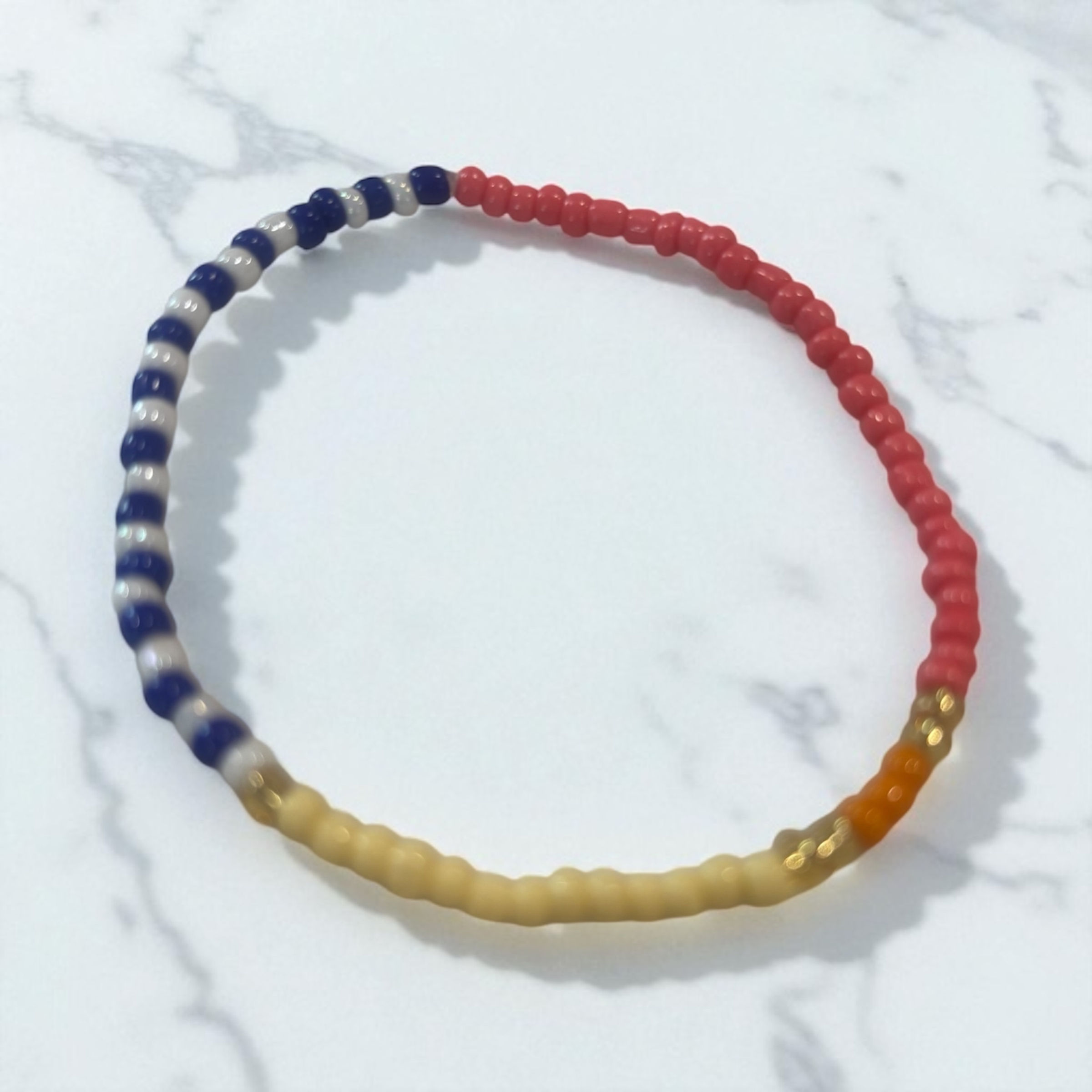 Blue, white, pink & yellow bracelet