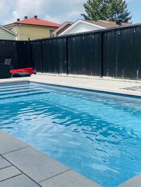 Modern clean look. Close up shot of copping and pavers arond pool