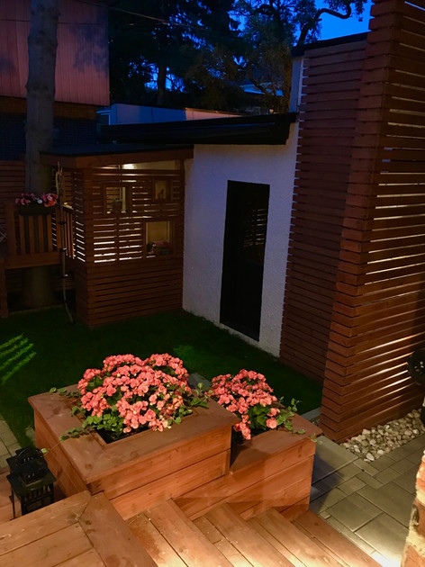Night view of this backyard project showcasing ambiance lighting