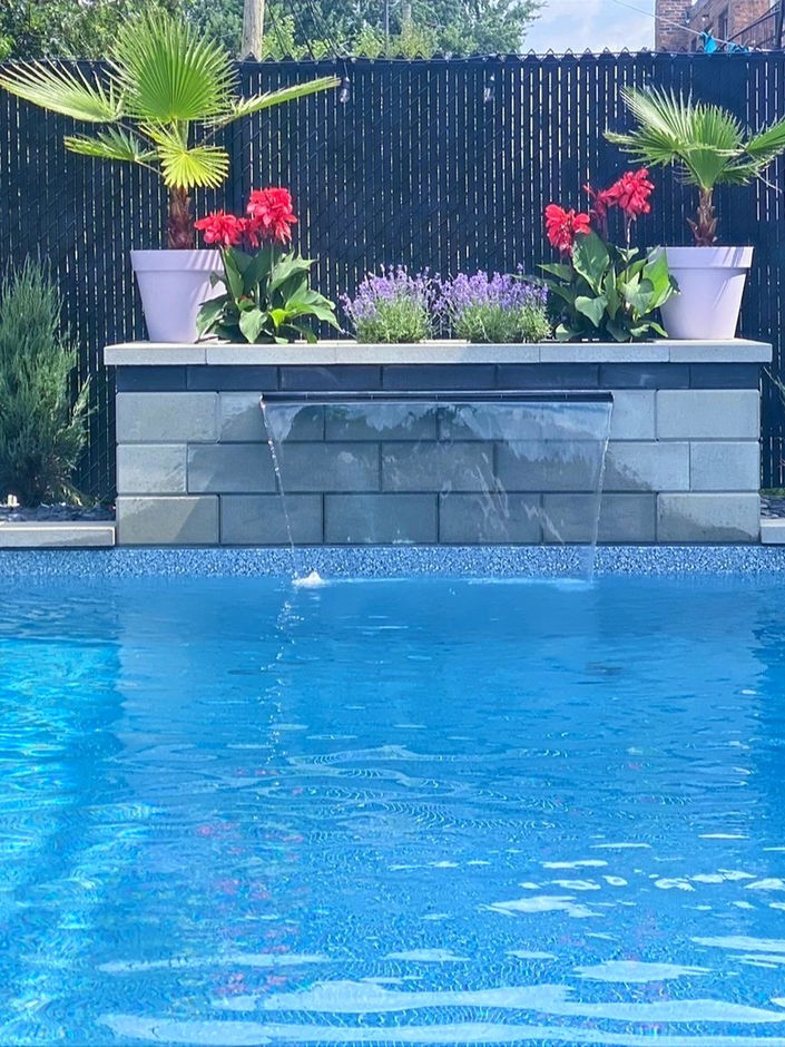 Modern clean look of a water feature with planting inside