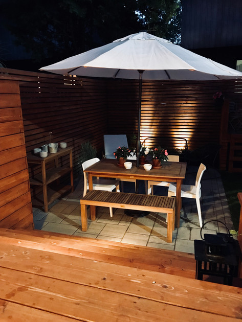 Night view of this backyard project showcasing ambiance lighting