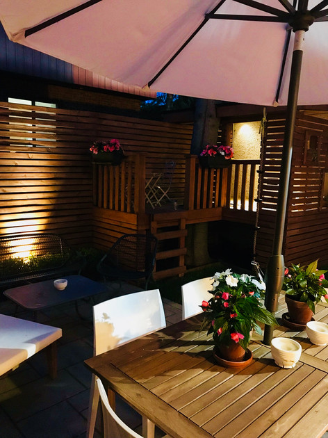 Night view of this backyard project showcasing ambiance lighting