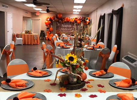 Table setting with orange decorations and text saying Pumpkin Spice for fall