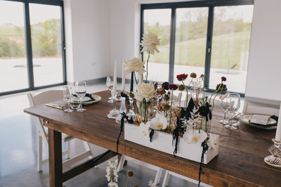 Meadow of flowers on top table at wedding cornwall