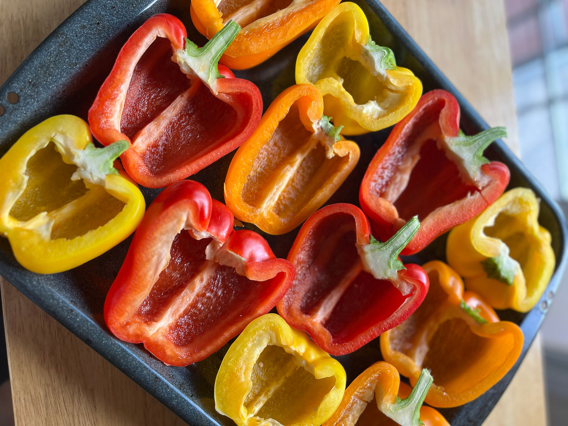 placing bell peppers on baking sheet