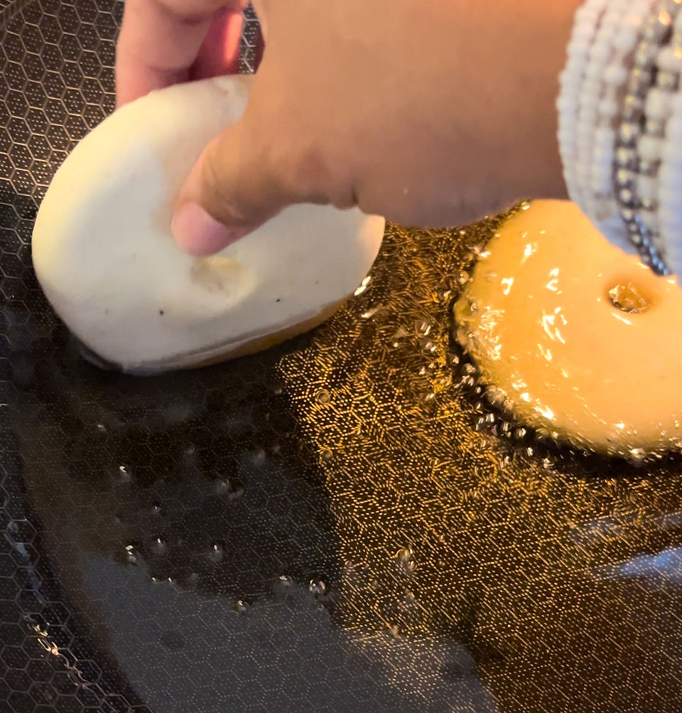 Frying Arepas in a wok or deep frying pan 