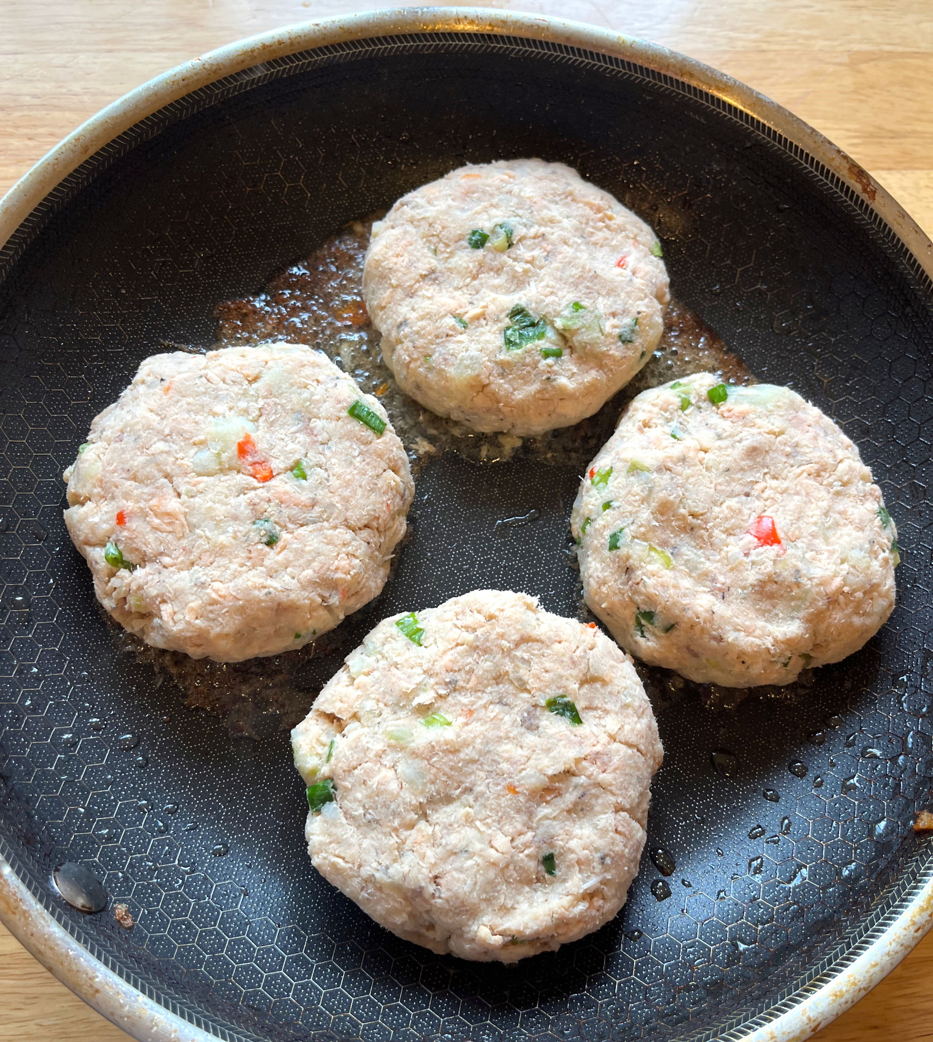 cooking salmon patties in non-stick pan until browned 