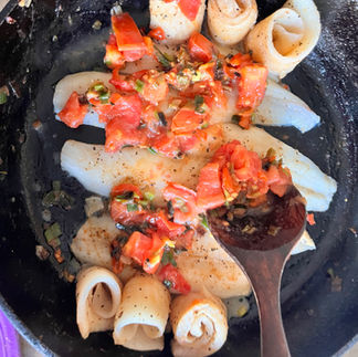Adding the Sofrito to the fish