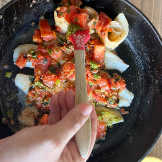Adding the pesto sauce 