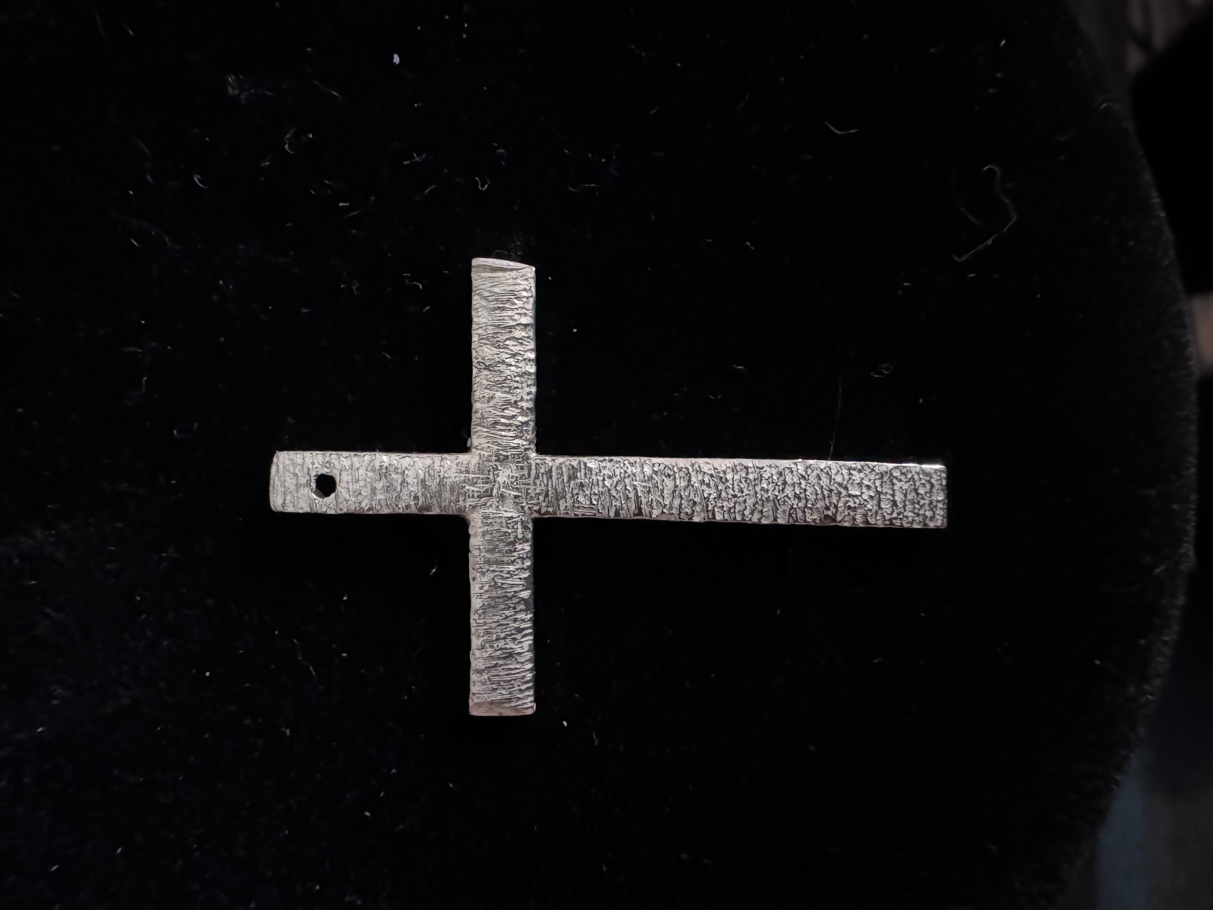 Sterling Silver cross with bark texture.