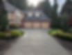 A perfectly cleaned driveway and house, all from Mr. Pristine's soft wash
