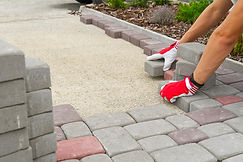 worker-laying-paving-stones-stone-paveme
