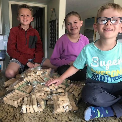 Bagging dog treats for homeless pets Southern Arizona Animal Food Bank-Crafting Kind Kids 