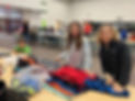 Kid Volunteers sort pajamas for Tucson kids in foster care.jpg