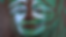 A painted mask with brown, green and blue colors