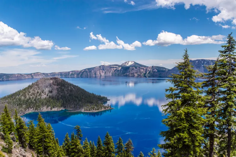 crater-lake-with-blue-water-1161782788-2b6b5822cf56448e90e185cab32ffd81.webp