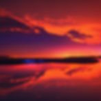 orange neon glow water at night subtle lights reflecting on water more sky .jpg