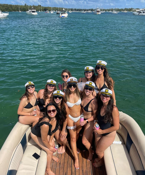Bachelorette group celebrating on a Miami boat rental with views of Miami Bay