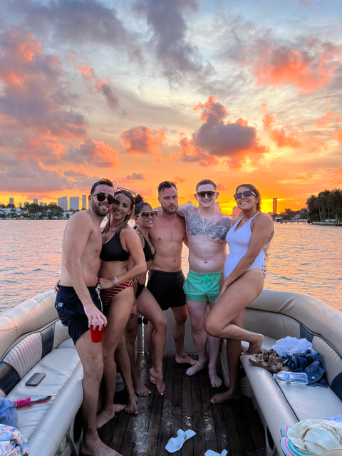 Sunset birthday celebration on a luxury Miami boat with Vice Boat Club, enjoying Miami bay skyline and  decorations