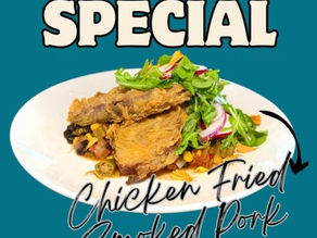 Plate of fried pork belly with greens on a blue background. Text reads "Chicken Fried Smoked Pork Belly" and "Available Now!" This is the newest menu item from The Polite Pig at Disney Springs.