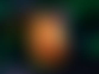 Shrimp cocktail in a glass with tomato sauce, topped with carrot shreds and cilantro, set against a dark, eerie green-lit background.