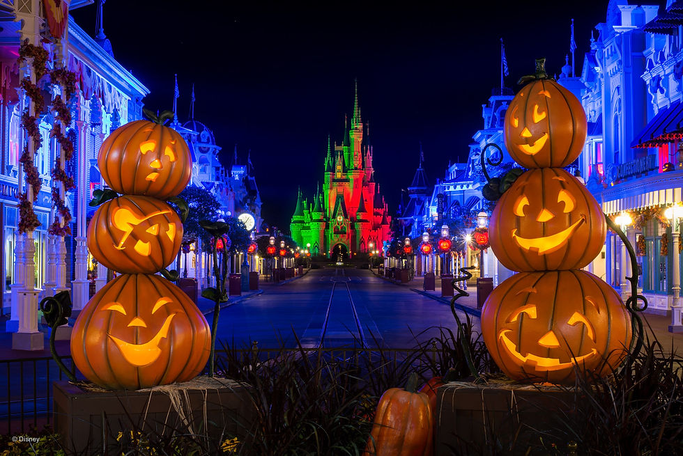Glowing jack-o'-lanterns line an illuminated street leading to a brightly lit castle. Festive, colorful lights create a magical ambiance.