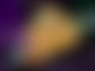 Fried croquettes topped with corn, diced greens, and creamy sauce on a blue plate. Background is dimly lit with purple and green hues.