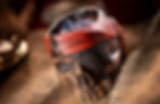 Skull-shaped mug with red bandana, eyepatch, and gold tooth on a textured surface. Soft lighting creates a dramatic mood. This is the new souvenir mug offered at the Beak & Barrel in the Magic Kingdom.