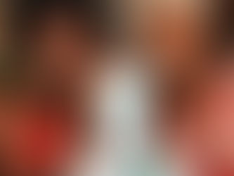 Two women smiling, showcasing skincare products on a table. One wears a red dress, the other a colorful headwrap. Text: CUGTARTH. Warm setting.