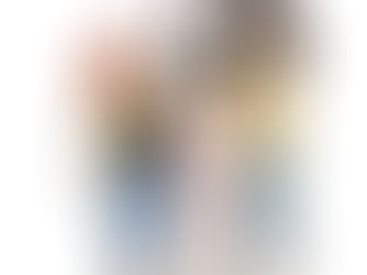 Three friends hugging each other and smilling.