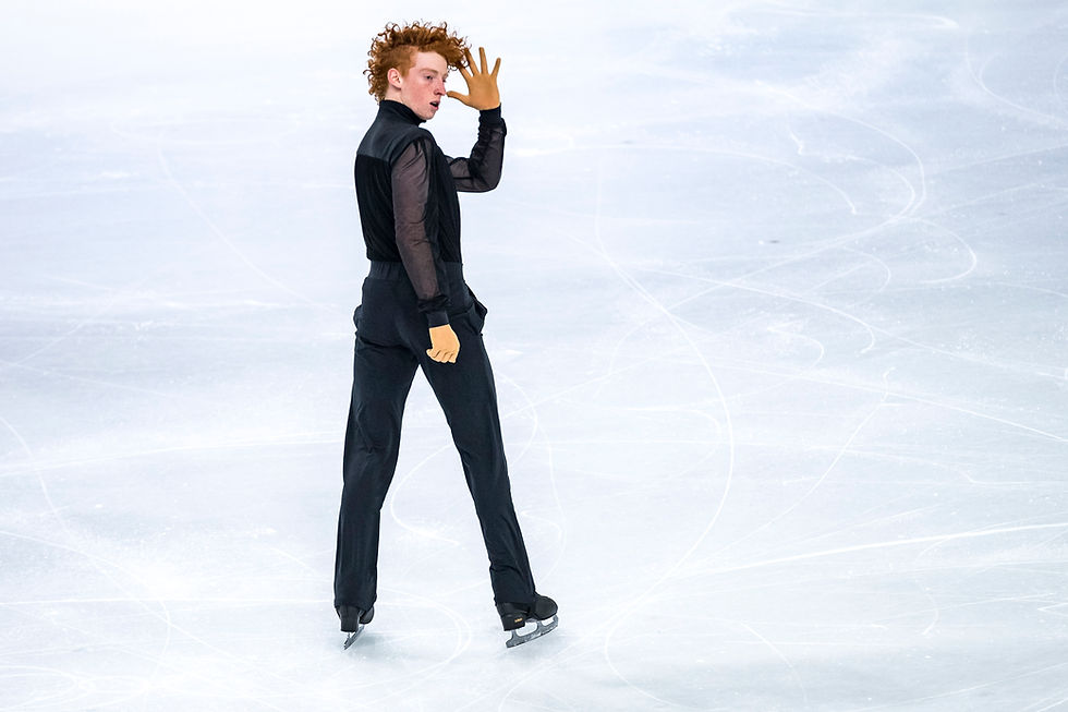 Freddie Leggott skates backwards on ice.