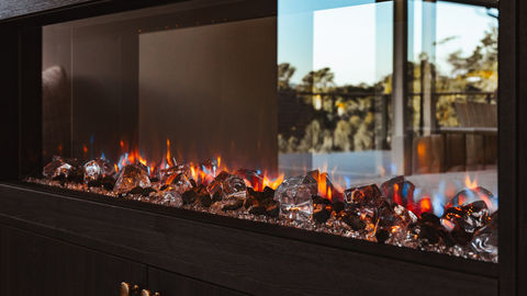 a fireplace with a lot of fire and ice in it