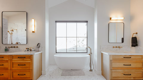 a bathroom with two sinks and a bathtub
