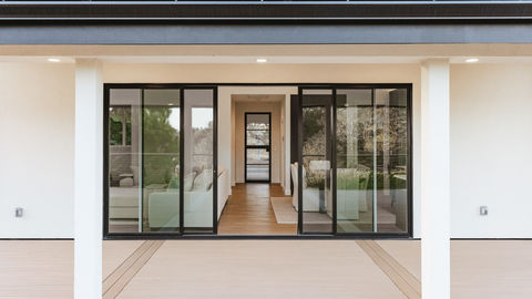 a sliding glass door opens to a living room