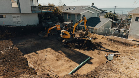 a case excavator is digging a hole in the dirt