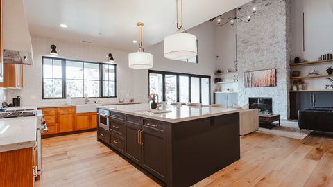 a kitchen with a large island in the middle