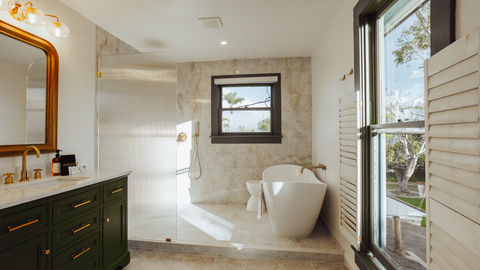 a bathroom with a bathtub and a window