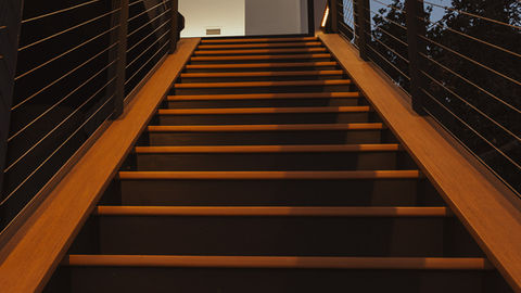 a set of stairs with wooden steps and a metal railing