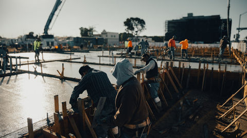 a group of construction workers are working on a construction site