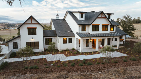 a large white house with a black roof