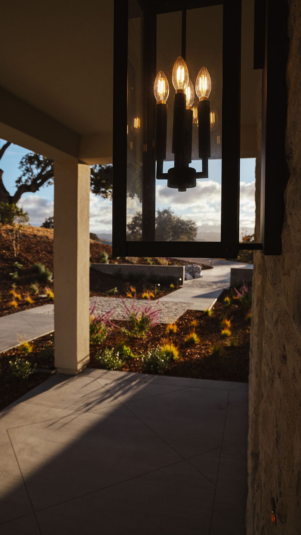 concrete walkway and lantern at sunset