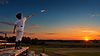 Paper airplane over sunset bleachers.png