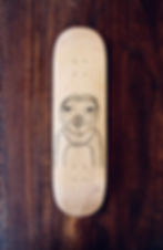pen on skateboard, picture of sloth