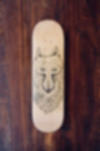 pen on skateboard, picture of wolf